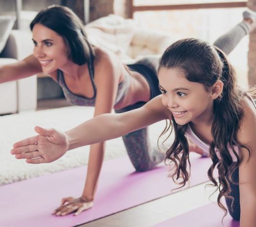 woman and child doing yoga