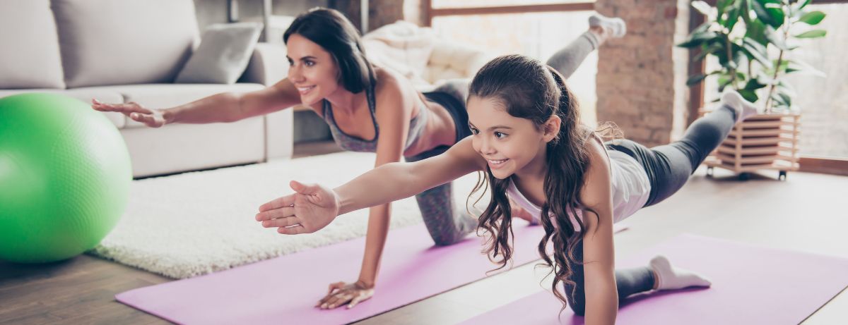 woman and child doing yoga