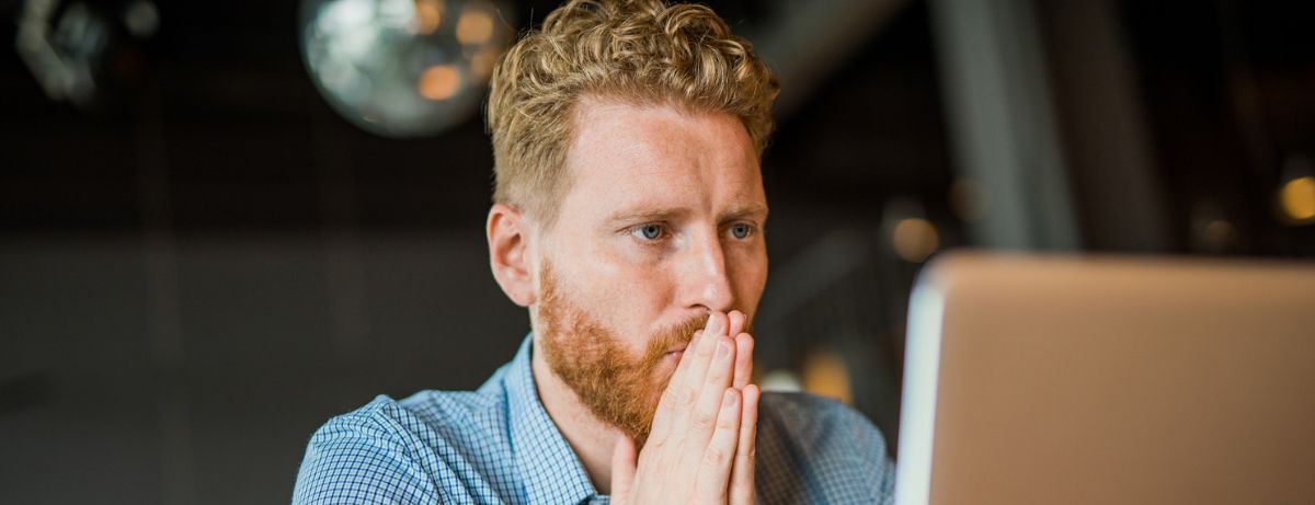 man looking at computer