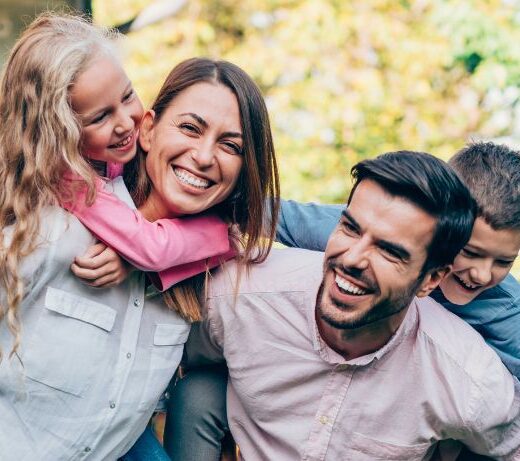 smiling family of four