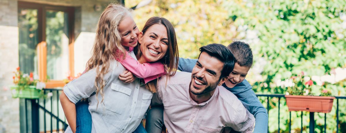 smiling family of four