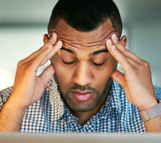 man stressed at computer