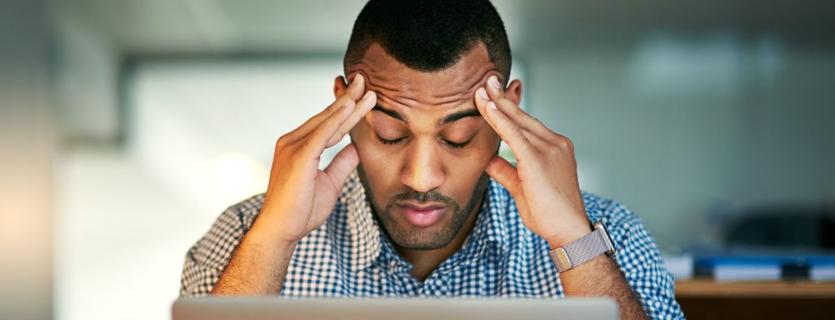 man stressed at computer