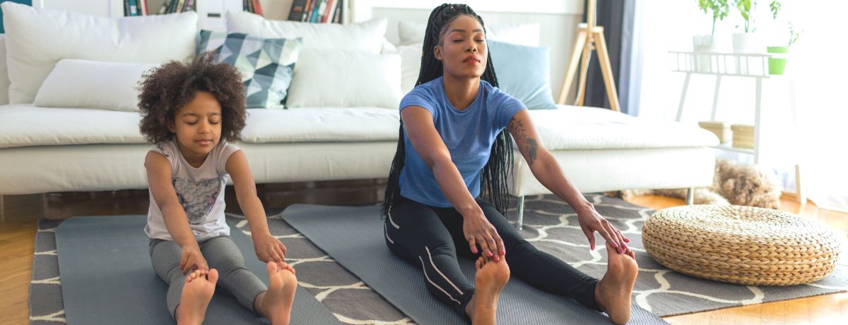 mom and daughter doing yoga