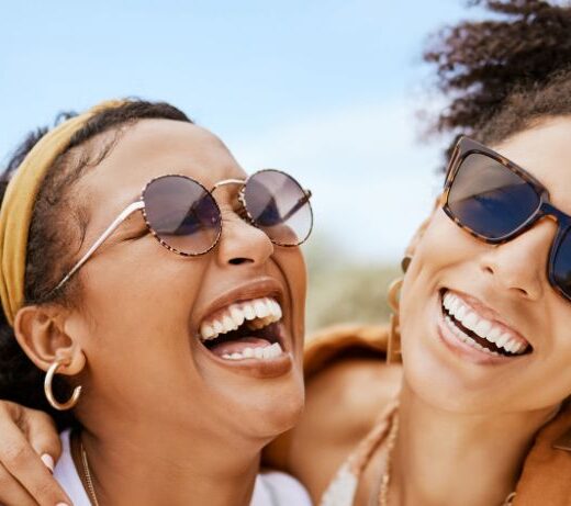 2 girls laughing and hugging