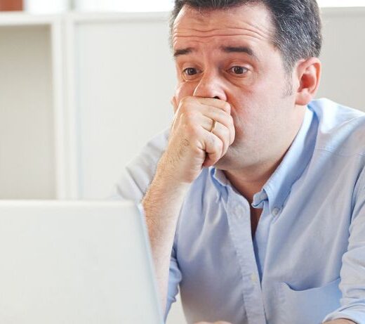 worried man on laptop