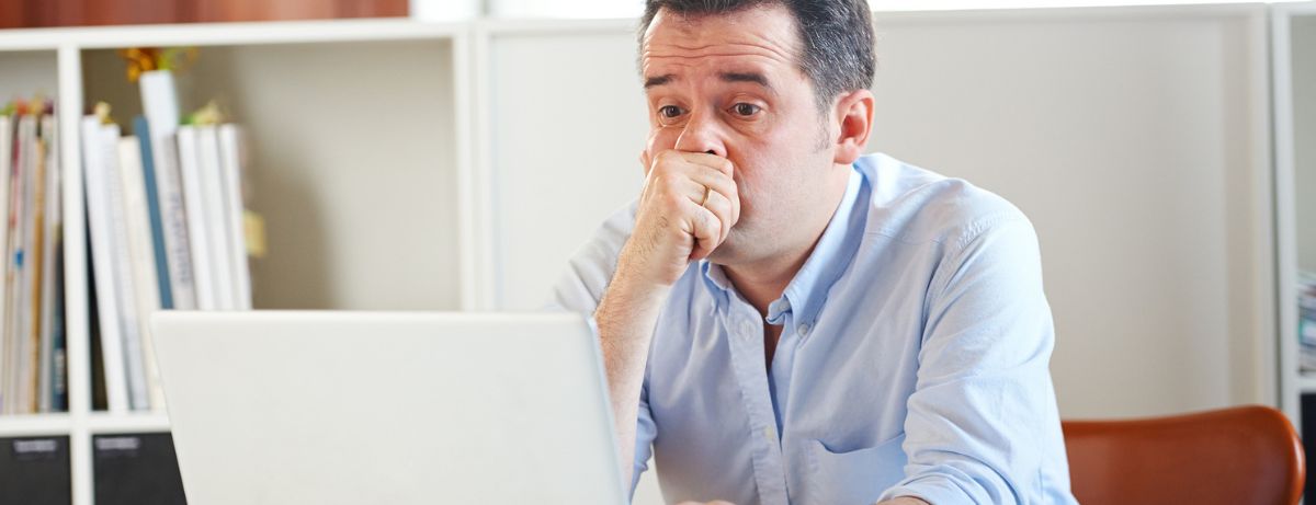 worried man on laptop