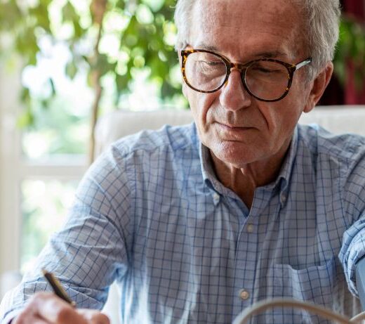 man taking blood pressure at home