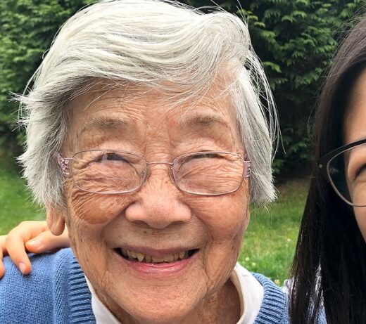 senior and young woman smiling