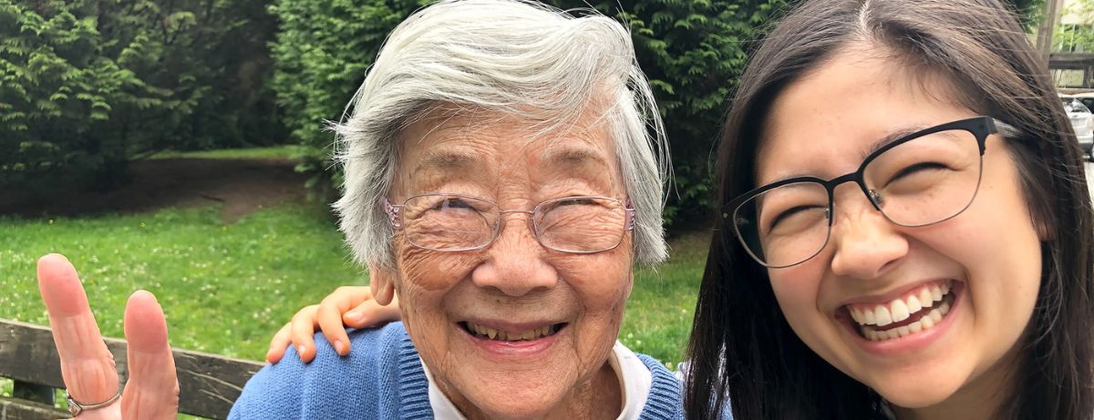 senior and young woman smiling