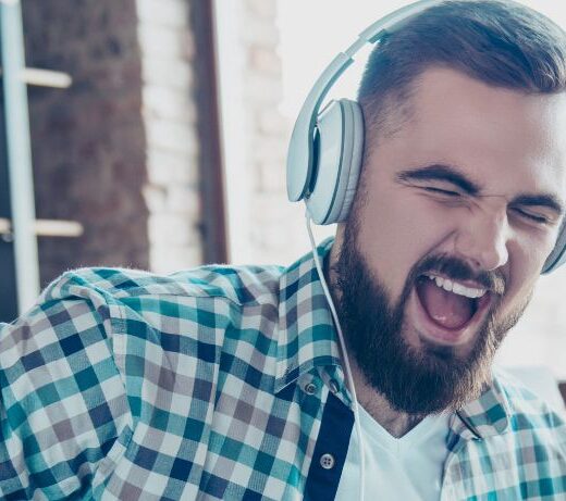 man jamming on air guitar