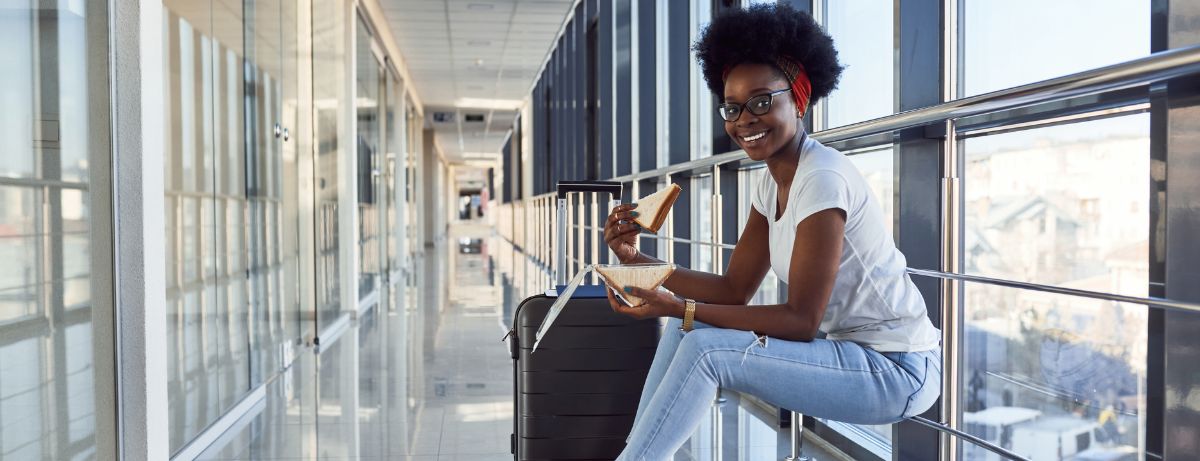 woman eating in airport