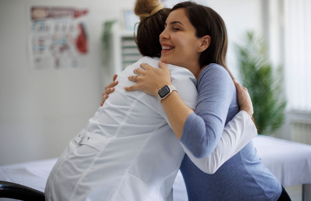 patient hugging doctor