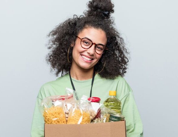 woman carrying box of food